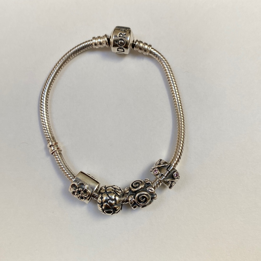 Pandora sterling silver charm bracelet with 3 charms and 1 clip 7 inch
